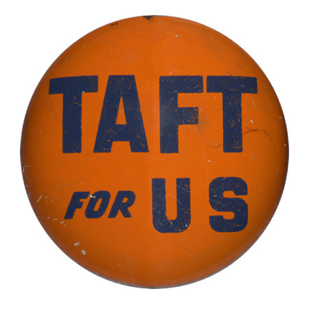 Round, orange button with blue text that reads "Taft for US". 