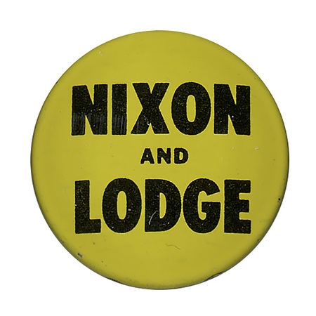 Round, yellow button with dark text reading "Nixon and Lodge". 