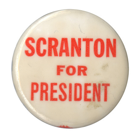 Round, white button with light red text reading "Scranton for President". 