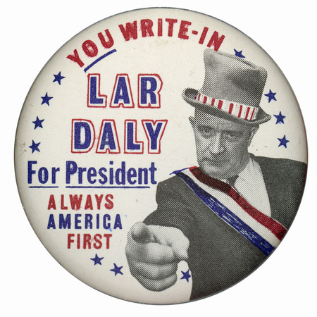 Round, white button with a grayscale portrait of Lar Daly in an 'Uncle Sam' pose. Red and blue text reads "You Write-In Lar Daly for President Always America First". Decorative blue stars border the button.