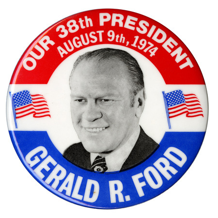 Round, white button with red and blue bands and a black and white portrait of Gerald Ford between two color US flags. White text reads "OUR 38th PRESIDENT AUGUST 9th, 1974 GERALD R. FORD"