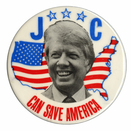 Round, white button with a black and white photograph of Jimmy Carter against a red, white, and blue drawing of the United States filled in by the flag's stars and stripes. Blue and red text reads "J C CAN SAVE AMERICA"