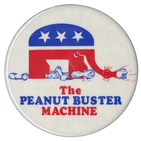 Round, white button with a red and blue drawing of the GOP elephant symbol destroying peanuts. Red and blue text reads "The PEANUT BUSTER MACHINE"