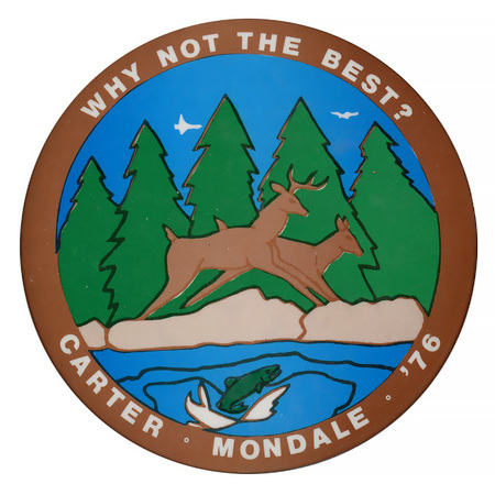 Round button with a color drawing of two deer, a fish jumping out of water, and trees. In a brown band along the edge of the button, white text reads "WHY NOT THE BEST? CARTER-MONDALE-'76"