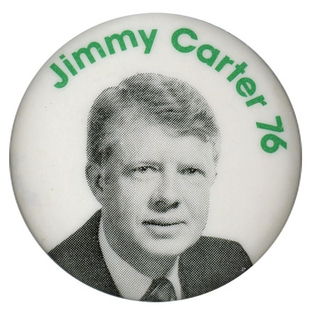 Round, white button with a black and white photograph of Jimmy Carter. Green text reads "Jimmy Carter 76"