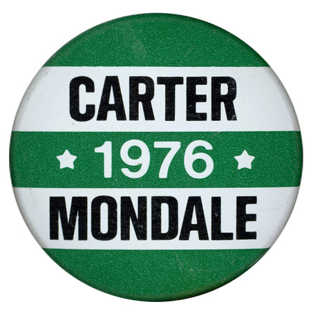 Round, green and white striped button with black and white text reading "CARTER 1976 MONDALE"