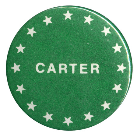 Round, green button with white stars and white text reading "CARTER"