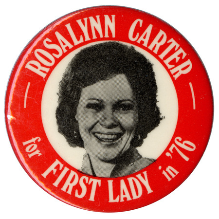 Round, red button with a black and white photograph of Rosalynn Carter in a white circle at the center. White text reads "ROSALYNN CARTER for FIRST LADY in '76"