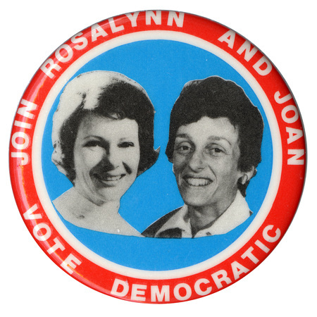 Round, red, white, and blue button with black and white photographs of Rosalynn Carter and Joan Mondale. White text reads "JOIN ROSALYNN AND JOAN VOTE DEMOCRATIC"
