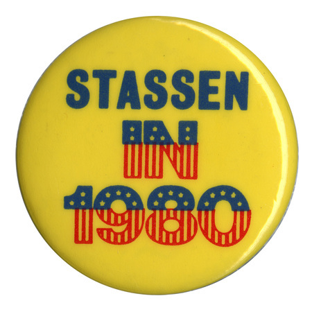 Round, yellow button with blue and red text reading "STASSEN IN 1980"