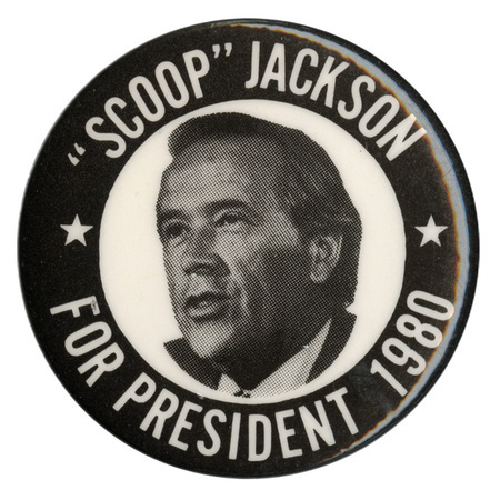Round, black button with a black and white photograph of Henry "Scoop" Jackson within a white circle. White text reads ""SCOOP" JACKSON FOR PRESIDENT 1980"