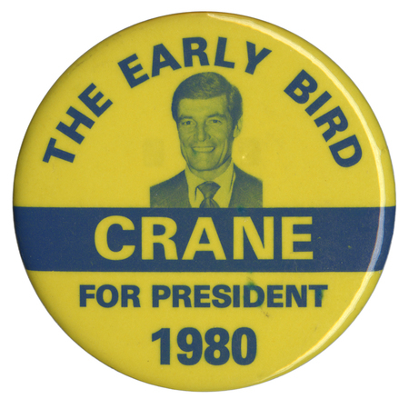 Round, yellow button with a photograph of Phil Crane. Blue and yellow text reads "THE EARLY BIRD CRANE FOR PRESIDENT 1980"