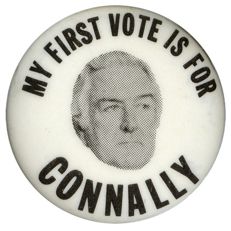 Round, white button with a black and white photograph of John Connally. Black text reads "MY FIRST VOTE IS FOR CONNALLY"