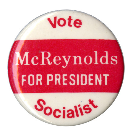 Round, white and red button with red and white text reading "Vote McReynolds FOR PRESIDENT Socialist"