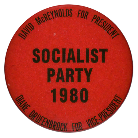 Round, red button with black text reading "DAVID McREYNOLDS FOR PRESIDENT SOCIALIST PARTY 1980 DIANE DRUFENBROCK FOR VICE-PRESIDENT"