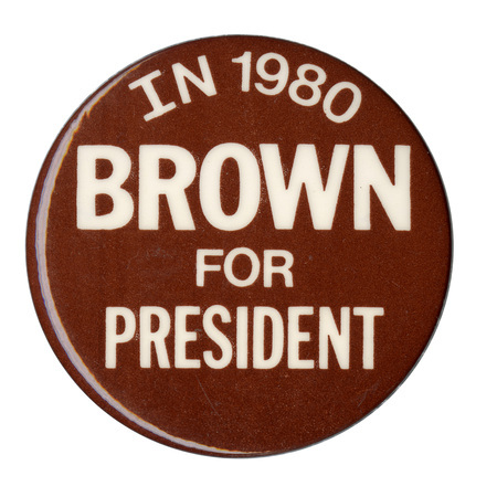 Round, brown button with white text reading "IN 1980 BROWN FOR PRESIDENT"