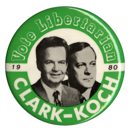 Round, green and white button with black and white photographs of Ed Clark and David Koch. White, green, and black text reads "Vote Libertarian 1980 CLARK-KOCH"