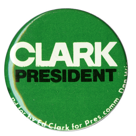 Round, green button with white and black text reading "CLARK PRESIDENT Pd for by Ed Clark for Pres. comm. Dan [illegible]