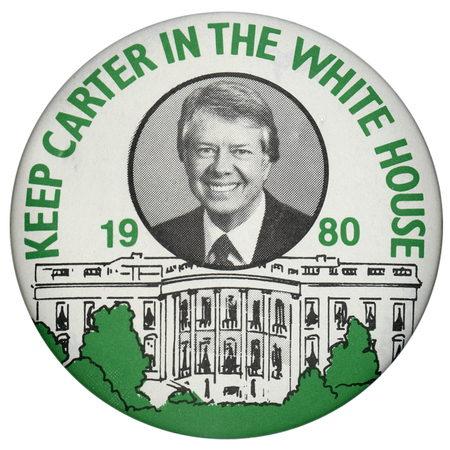 Round, white button with a black, white, and green drawing of the White House and surrounding shrubbery. A black and white photograph of Jimmy Carter appears in a black circle above. Green text reads "KEEP CARTER IN THE WHITE HOUSE 1980"