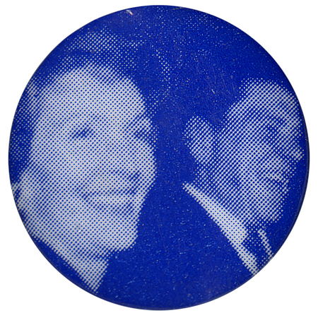 Round, blue button with a blurry photograph of Nancy Reagan and Ronald Reagan.