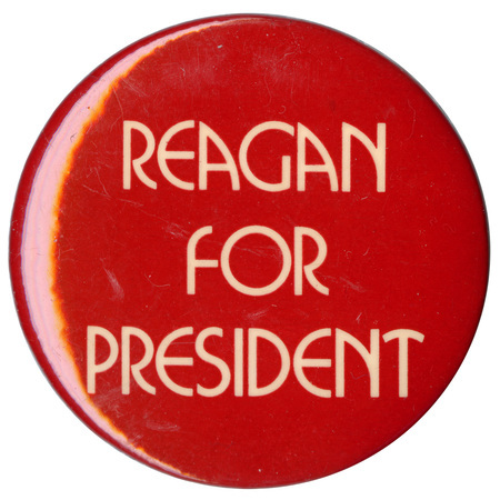 Round, red button with white text reading "REAGAN FOR PRESIDENT"