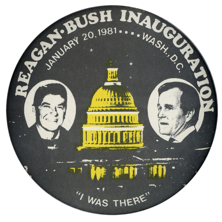 Round, black button with black and white photographs of Ronald Reagan and George H. W. Bush on either side of a yellow photograph of the US Capitol building at night. White text reads "REAGAN-BUSH INAUGURATION JANUARY 20, 1981...WASH., D.C. "I WAS THERE""