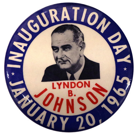 Round, blue and white button with a portrait of Lyndon B. Johnson and white and red text reading "Inauguration Day, January 20, 1965, Lyndon B. Johnson."