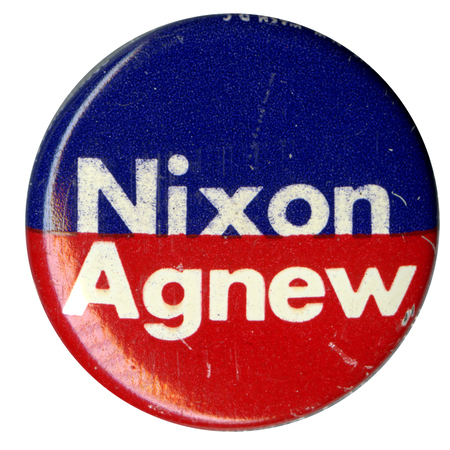 Round, blue and red button with white text reading "Nixon Agnew."