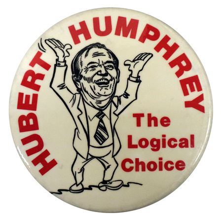 Round, white button with a black line drawing caricature of Hubert Humphrey. Red text reads "Hubert Humphrey, The Logical Choice."