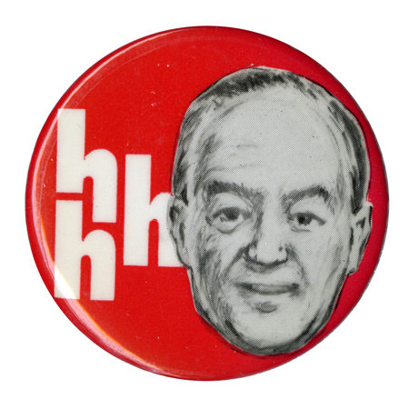 Round, red button with a black and white drawing of Hubert Humphrey and the text "h h h."