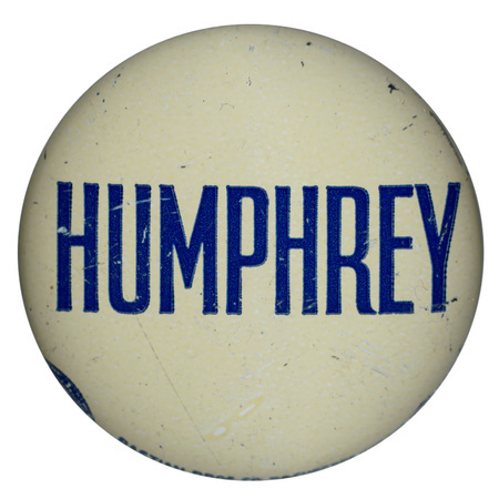 Round, off white button with the text "Humphrey."