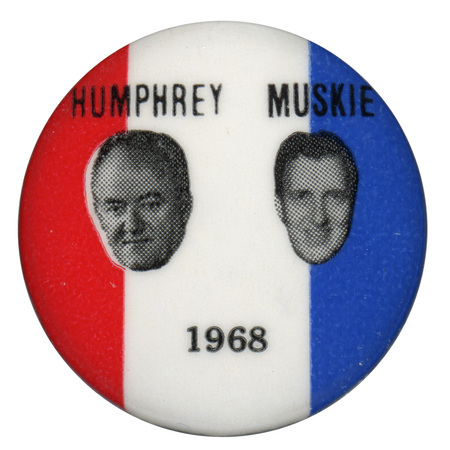 Round, red, white, and blue button with portraits of Hubert Humphrey and Edmund Muskie and black text reading "Humphrey Muskie 1968."