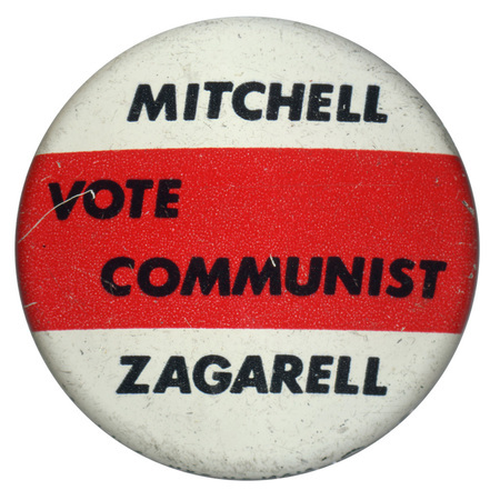 Round, white and red button with black text reading "Vote Communist, Mitchell Zagarell."
