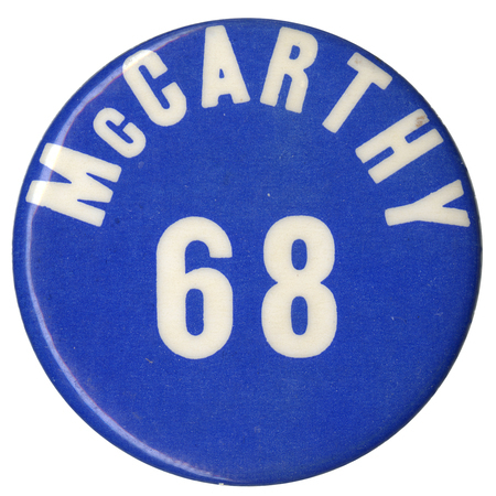 Round, blue button with white text reading "McCarthy 68."