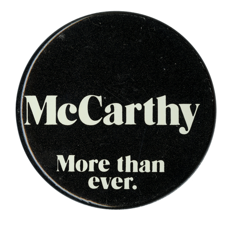 Round, black text with white text reading "McCarthy, More than ever."
