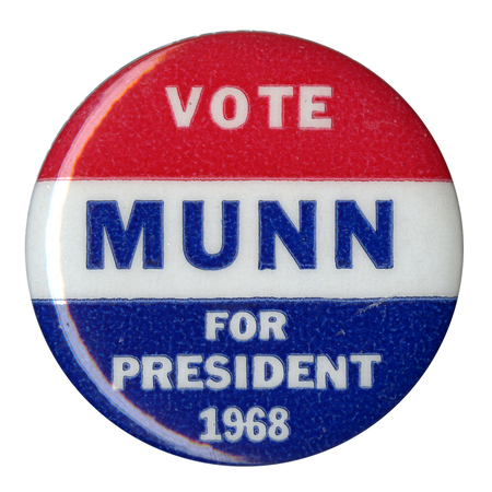 Round, red, white, and blue button with text reading "Vote Munn for president 1968."