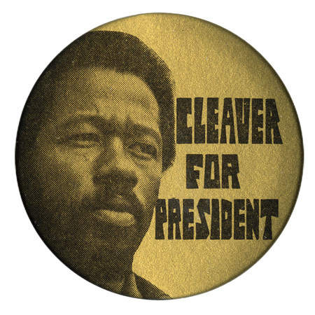 Round, gold button with a portrait of Eldridge Cleaver and black text reading "Cleaver for President."