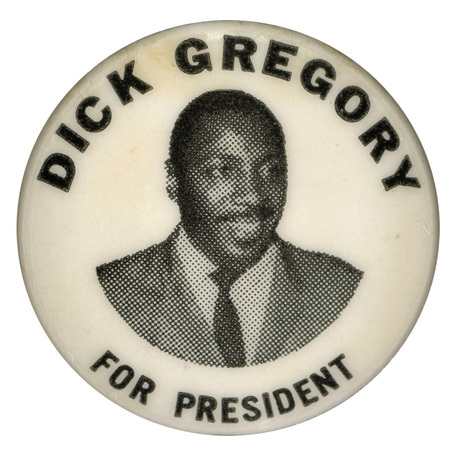 Round, white button with a portrait of Dick Gregory and text reading "Dick Gregory for President."