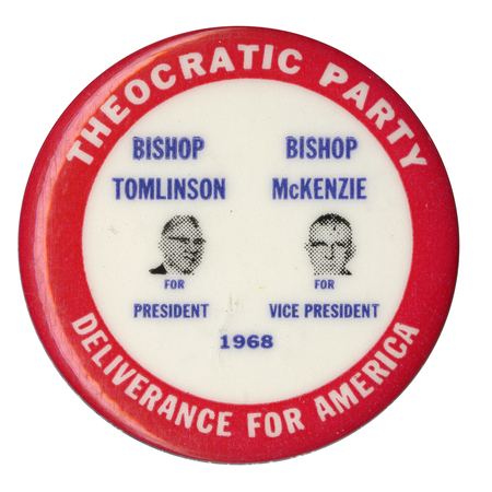 Round, white and red button with portraits of Homer Tomlinson and Arthur McKenzie and text reading "Theocratic Party, Deliverance for America, Bishop Tomlinson for President, Bishop McKenzie for Vice President, 1968."