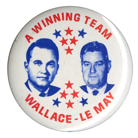 Round, white button with portraits of George Wallace and Curtis LeMay and blue and red star decorations. Red text reads "A Winning Team, Wallace-LeMay."