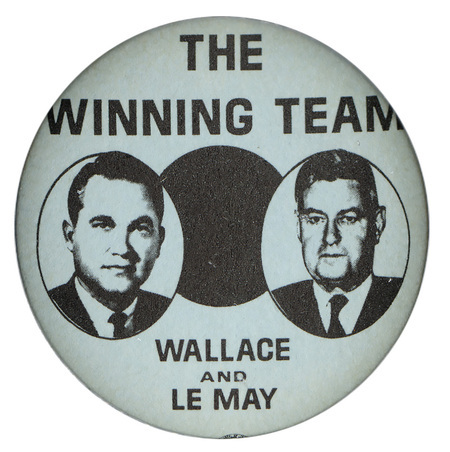 Round, white button with black and portraits of George Wallace and Curtis LeMay in black circles. Black text reads "The Winning Team, Wallace and LeMay."
