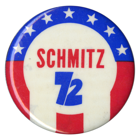 Round button with white stars on a blue field and red and white stripes. Red and blue text reads "SCHMITZ 72"