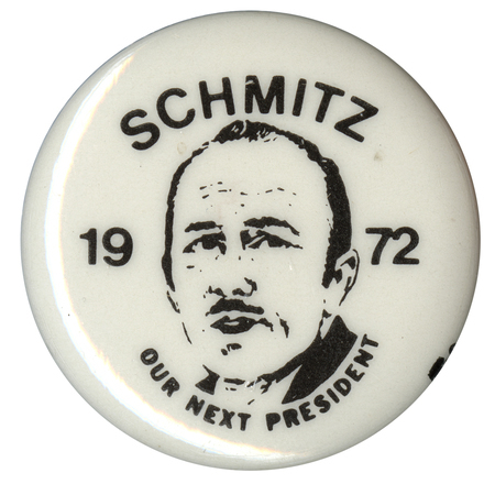 Round, white button with a portrait of John Schmitz and black text reading "SCHMITZ 1972 OUR NEXT PRESIDENT"