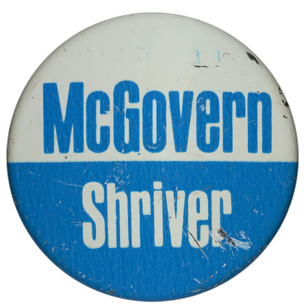 Round, white and blue button with blue and white text reading "McGovern Shriver"
