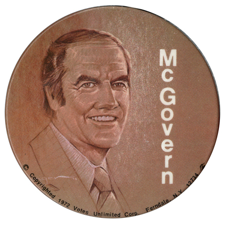 Round, brown button with a brown and white drawing of George McGovern and white text reading "McGovern"
