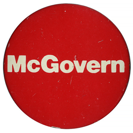 Round, red button with white text reading "McGovern"
