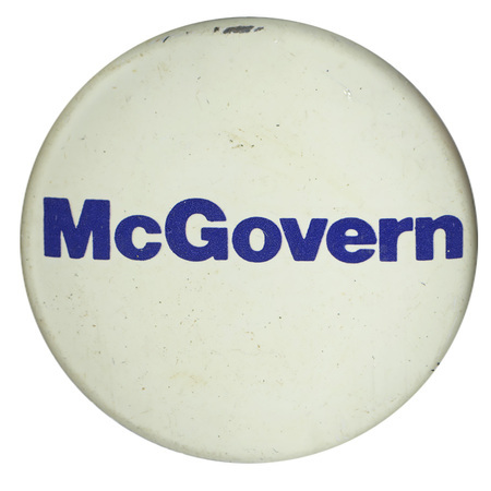 Round, white button with white text reading "McGovern"