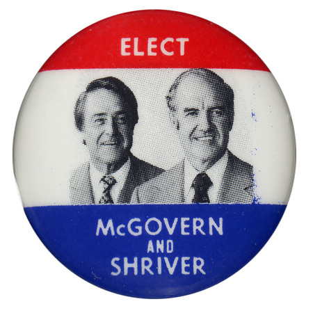 Round button with red, white, and blue bands and portraits of George McGovern and Sargent Shriver. White text reads "ELECT McGOVERN AND SHRIVER"