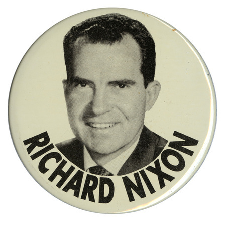 Round, white button with a black and white portrait of Richard Nixon and black text reading "RICHARD NIXON"