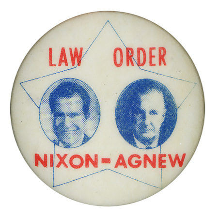 Round, white button with blue portraits of Richard Nixon and Spiro Agnew against a blue star-shaped outline. Red text reads "LAW ORDER NIXON-AGNEW"